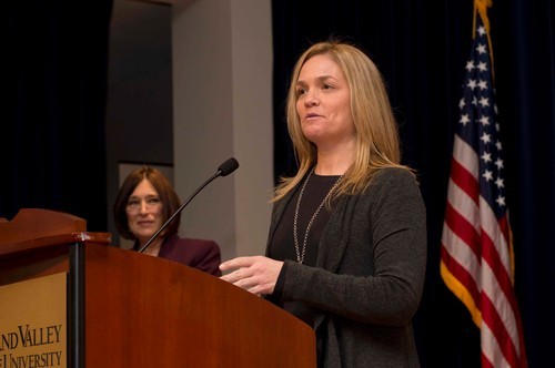 Woman speaks at event